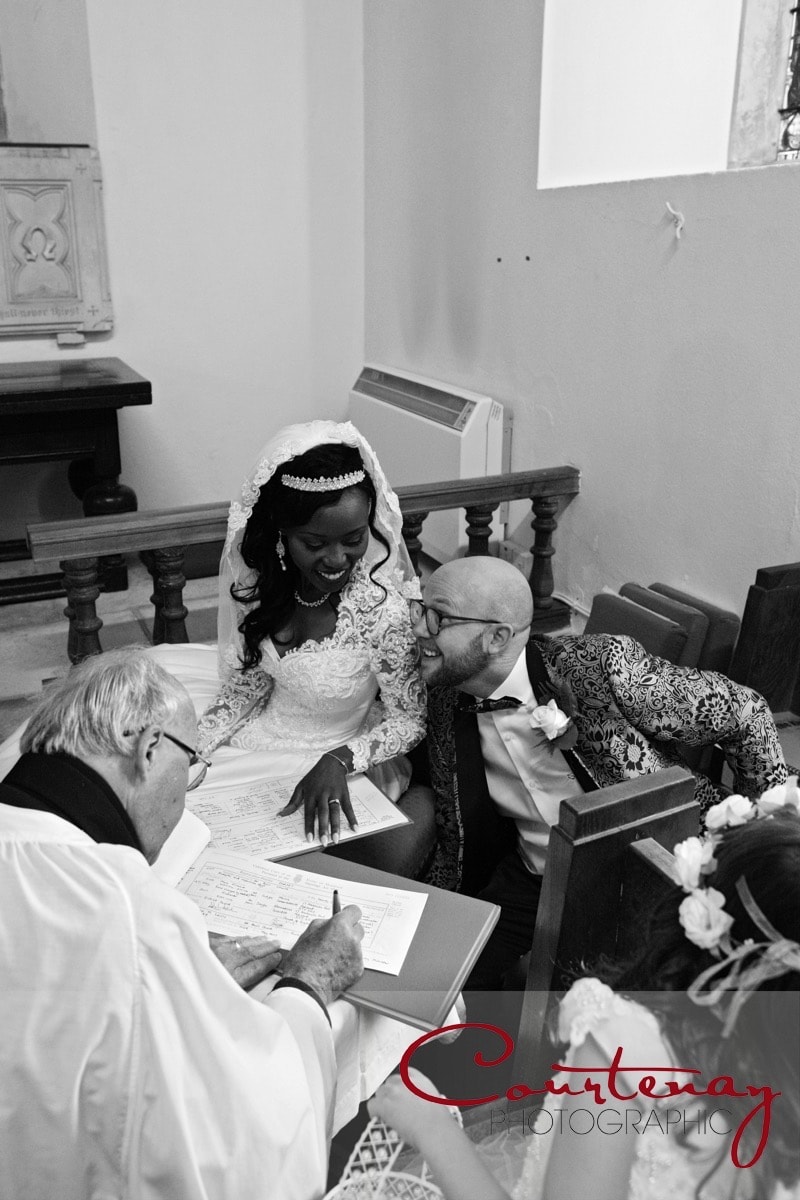 newlyweds shre a moment over signing the register